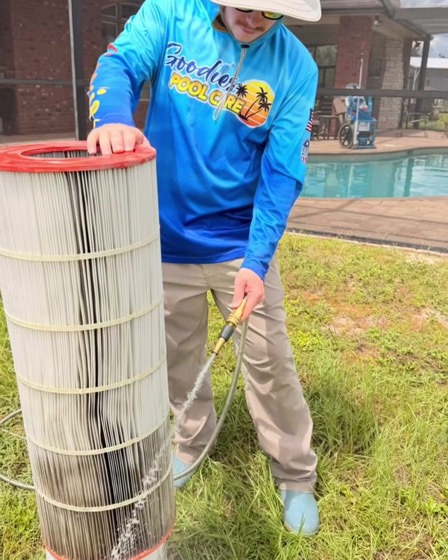 A Goodies Pool Care technician beside a rinsed pool filter cartridge